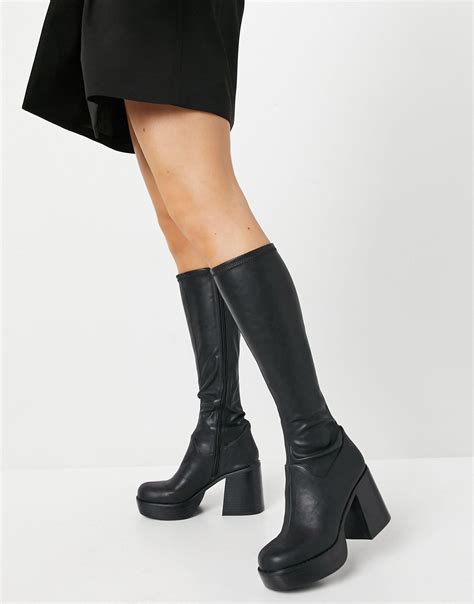 Asos black boots - Simmi London Henry high ankle boots with embellished toe in black. $96.00. ALDO Phara stiletto heel ankle boots in black knit. $174.00. ALDO Stompd chunky ankle boots in black leather. $243.00. RAID Greta chunky low ankle boot with hardware in black. $87.00. Public Desire Wide Fit Lilu ruched heeled ankle boots in black.